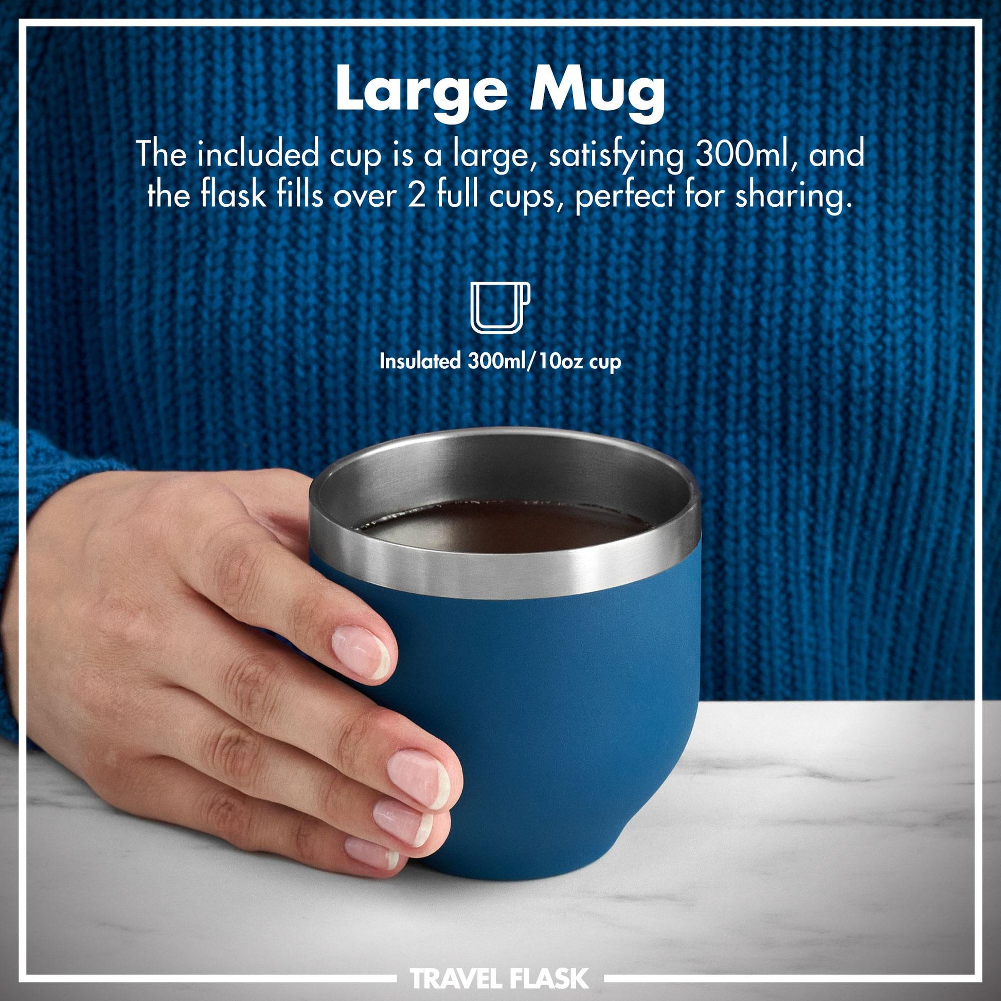 Blue insulated ION8 mug with a metal rim held by a hand, against a blue textured background.
