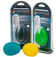 Two packaged Fortress Exercise egg hand exercisers on a white background, with one dark gray/black egg in the left package and one green egg in the right package. Two loose eggs, one teal and one yellow, are placed in front.
